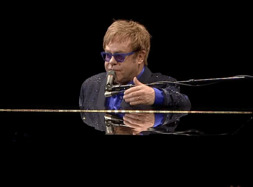 Elton John performing at the piano for Daniel Pearl World Music Days